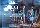 Three team members work together on a project.