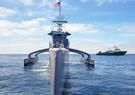 The Leidos Seahunter ship cuts through water.