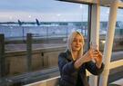 woman taking selfie at airport