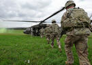 soldiers en route to helicopter