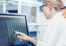 Scientist reviewing data on computer