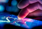 A hand moves across a touchscreen.