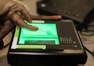 A person scans their fingerprints