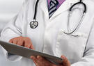 Medical professional using a tablet