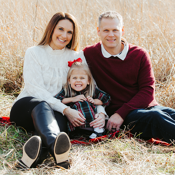 Allison, Hailey, and John in a family photo