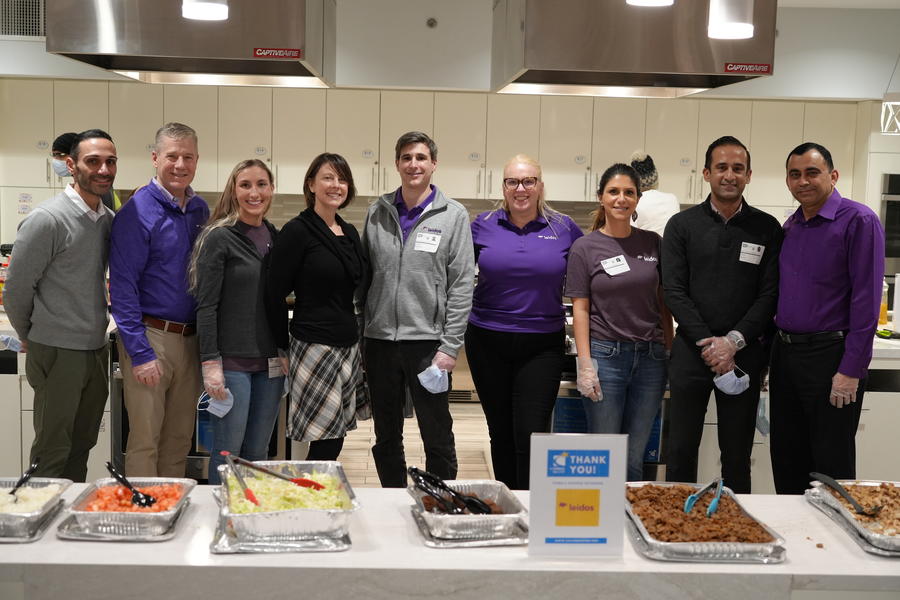 group of employees posing in front of meal service