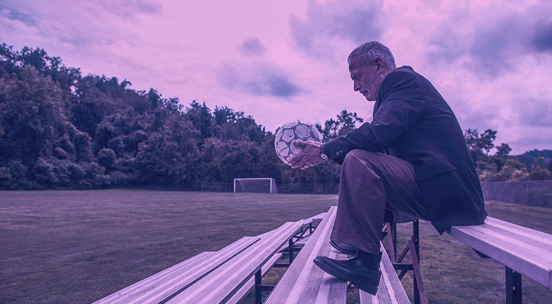 Leidos employee John Hindman holds a soccer ball that belonged to his son, Sean.