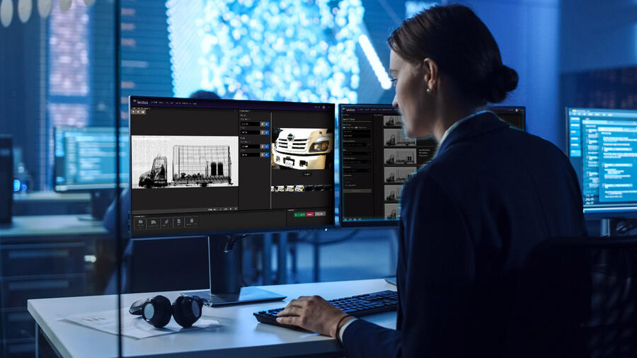 woman at desk viewing scanning application