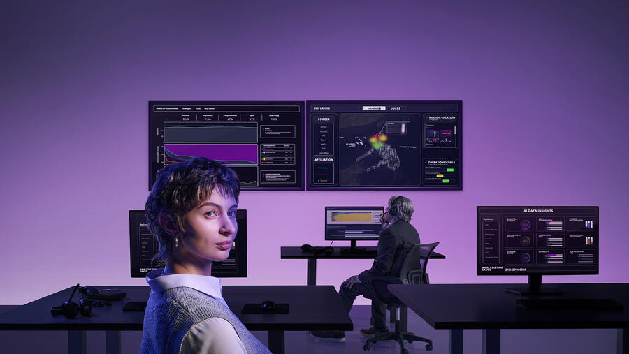 A modern operations center displays mission analytics, geospatial intelligence, and data visualizations on multiple screens as analysts monitor and assess information