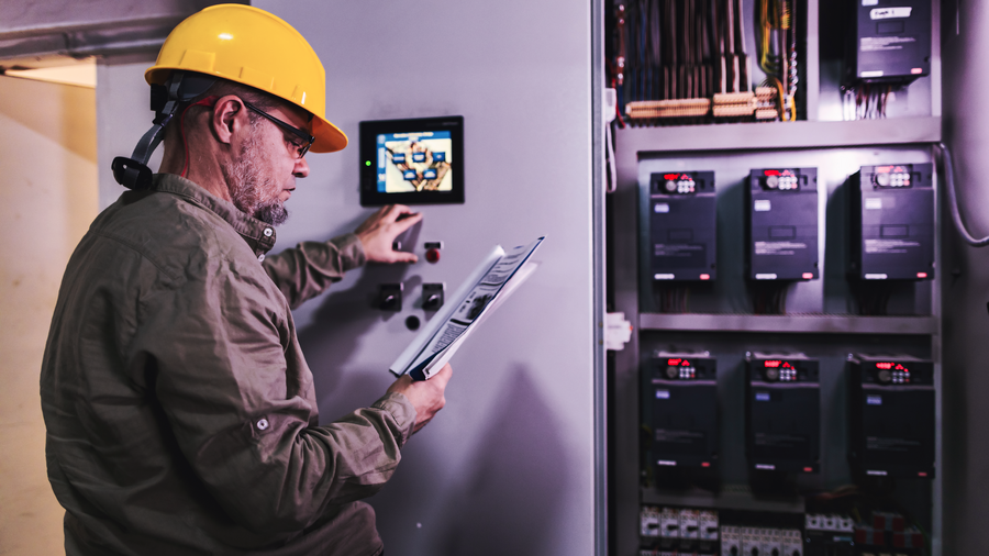 Engineer works on a control panel