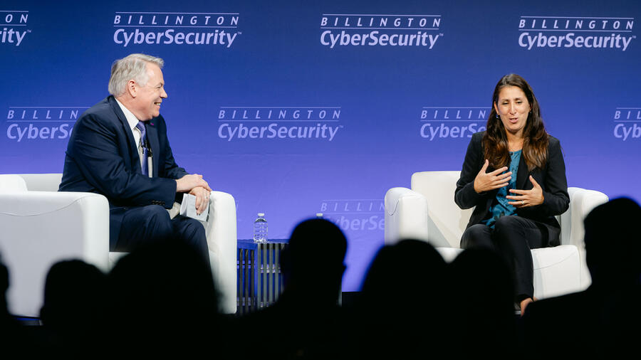 Two speakers discuss cybersecurity on stage during a panel at the 2026 Billington CyberSecurity Summit.