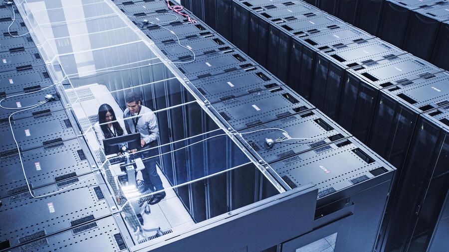Two professionals in a data center