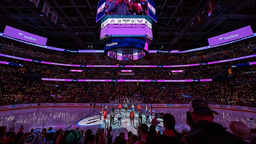 Capital One Arena lit up in purple before an NHL hockey game