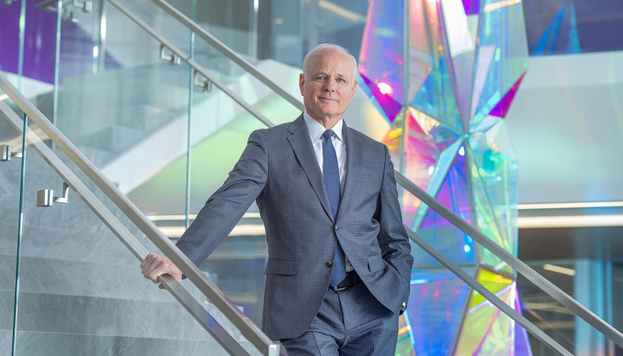 Thomas Bell standing in a stairway at Leidos GHQ