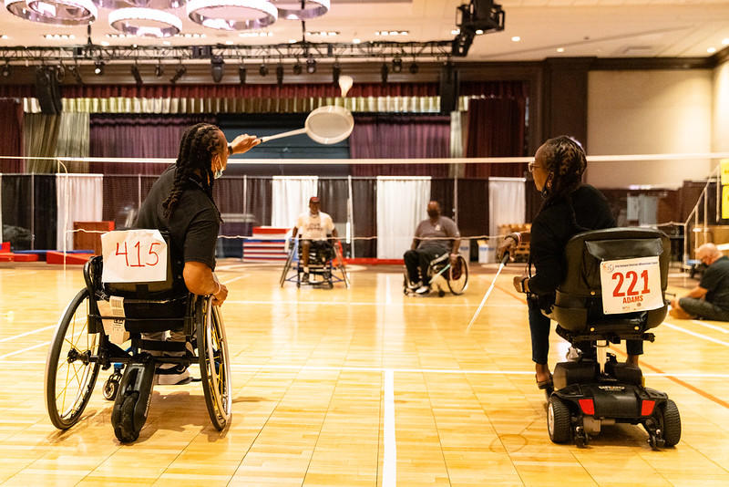 Veterans playing racquetball in wheelchairs