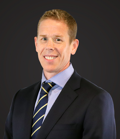 Man in suit smiling at camera