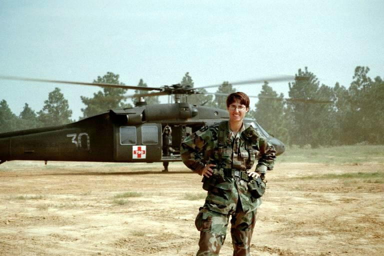 Nanette Patton in the desert about to board a helicopter