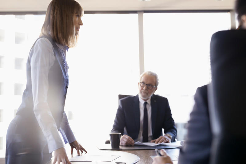 Executives talking in a board room