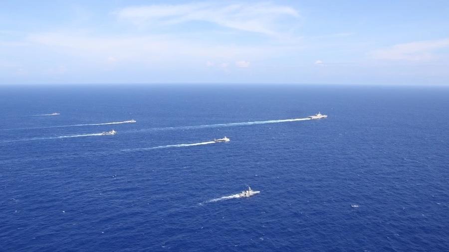 A task group including several unmanned surface vessels crossing the Pacific Ocean
