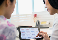 Two people analyzing health data