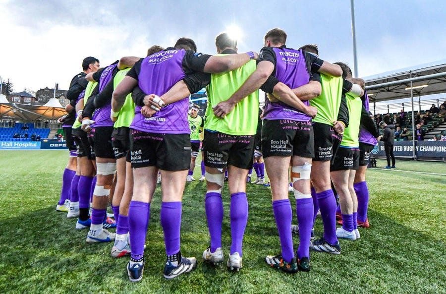 Glasgow Warriors in a team huddle