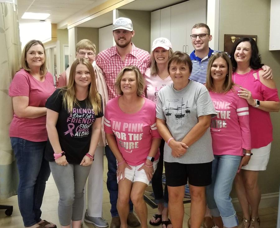 Dinah Ray, back row middle, celebrates her last day of chemotherapy with family and friends.