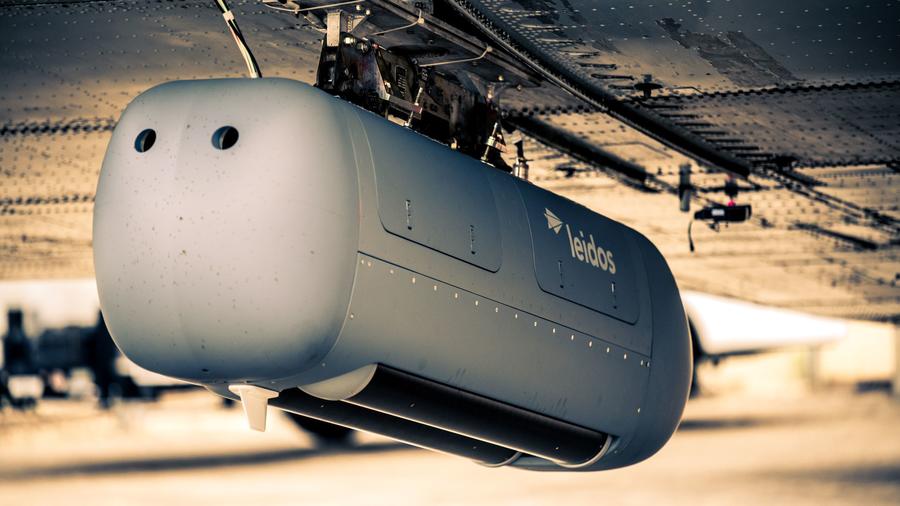 A Leidos adaptable military pod attached to a Douglas DC-3 test aircraft