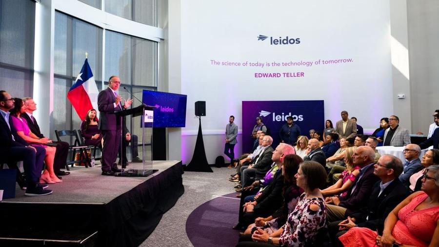 Leidos Sr. Vice President Anil Tailor delivering a keynote to an audience at the new Leidos office in Port San Antonio