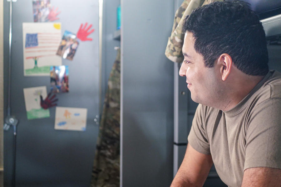 Veteran looking at drawings on locker