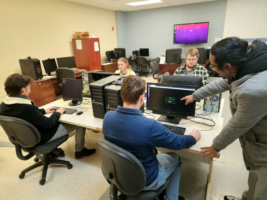 Group of students working on desktop computers