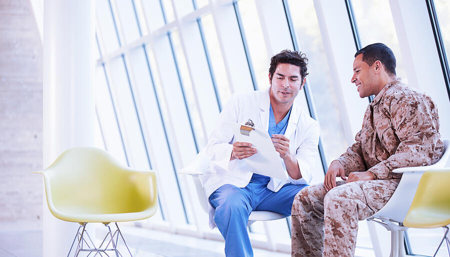 Military Health with doctor and solider discussing care