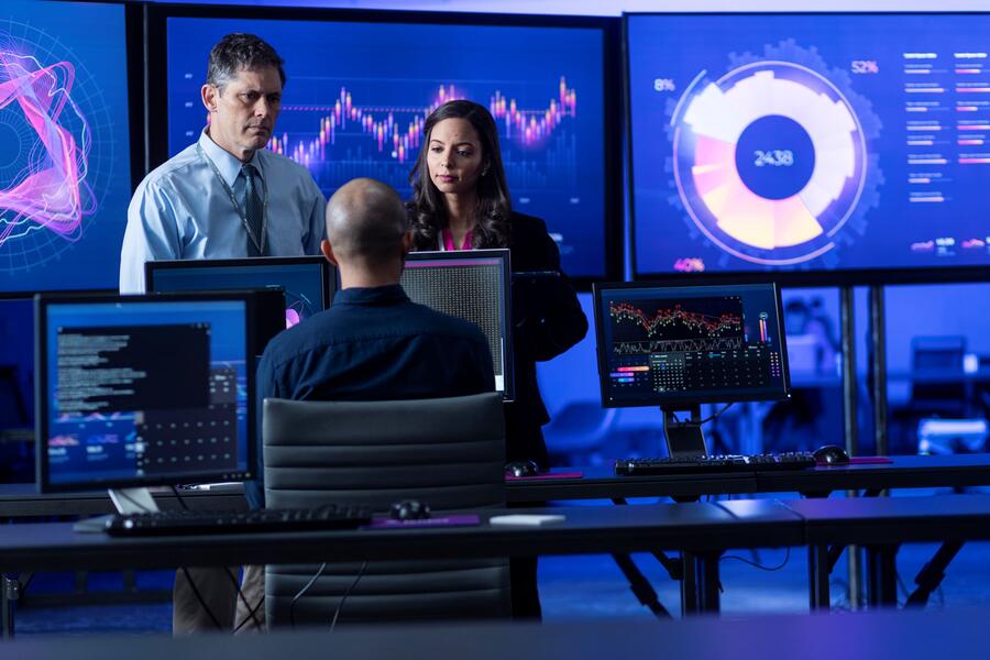 3 people at computer screens