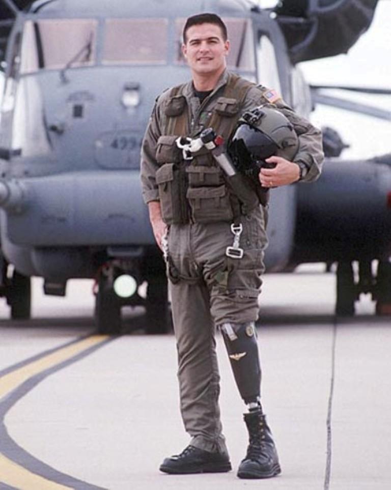 John Alvarez standing in front of an aircraft