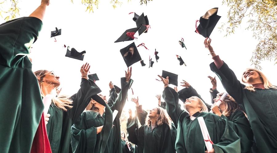 New graduates tossing their caps in celebration