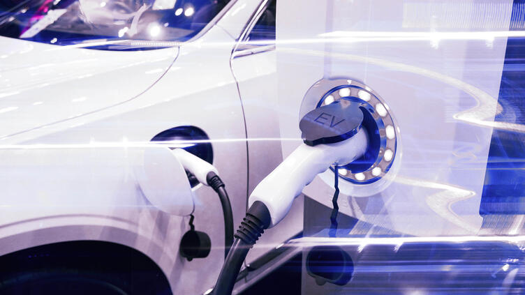 Close up of white EV charging port in use