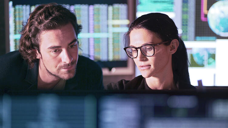 Cyber analysts discussing data