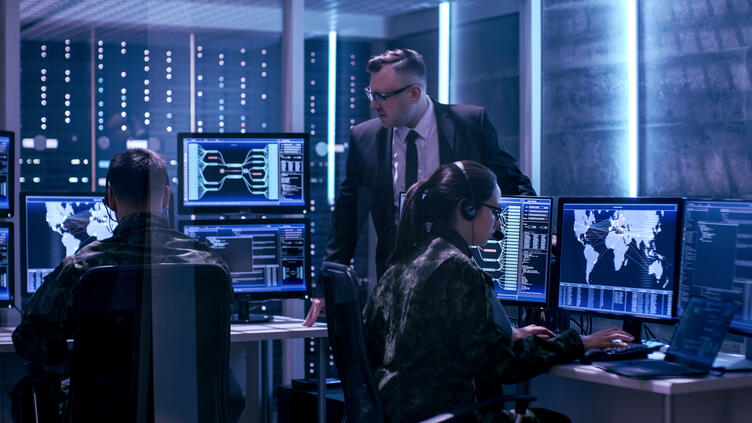 Team in uniforms working in a SCIF