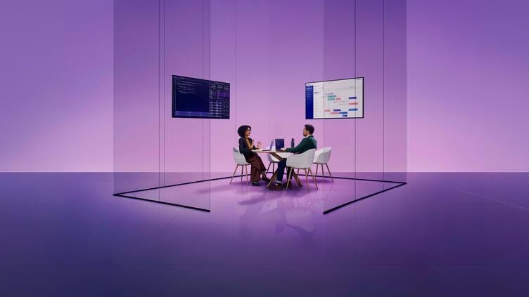 two professionals collaborate in a glass office