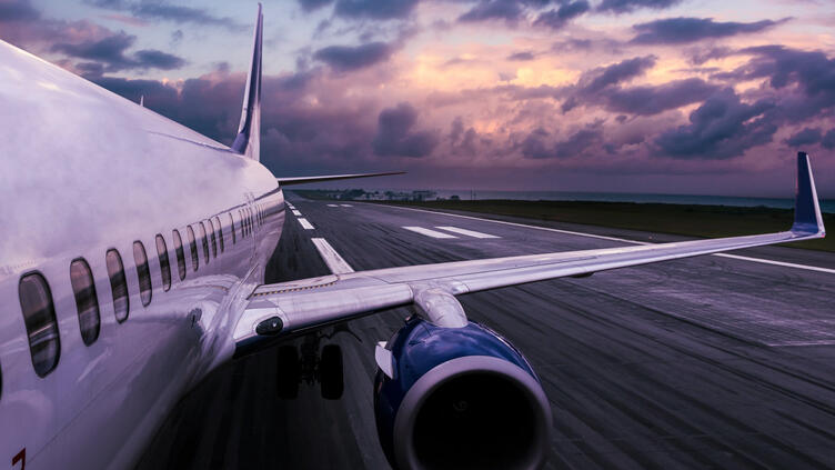Side view of airplane on the runway