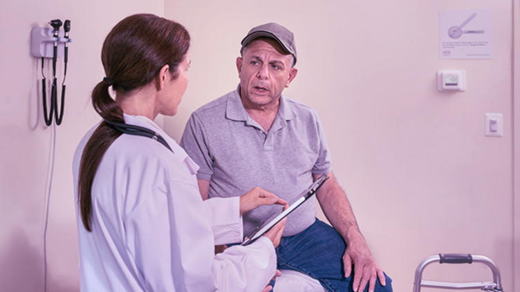 Senior patient with doctor