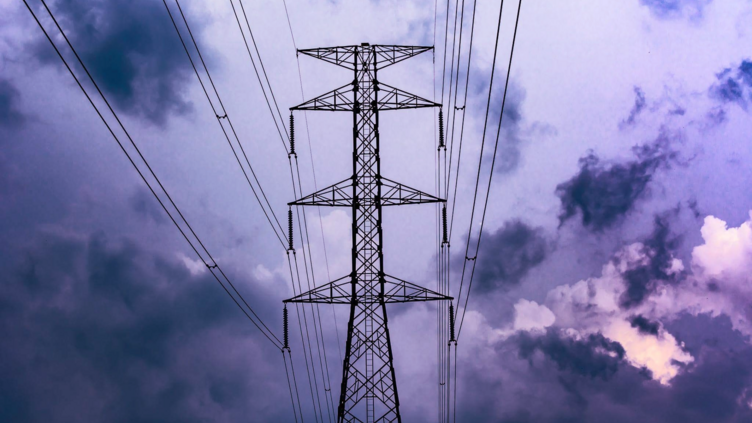 power lines with a blue purple sky background