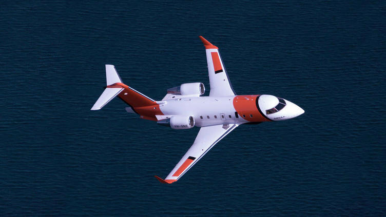 Plane flying over the ocean