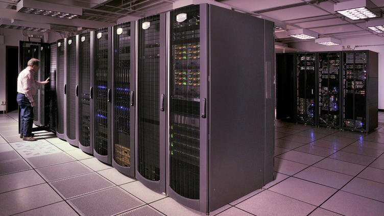 A data centre with a man in the far left 