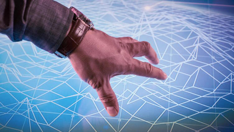  A hand is on a screen