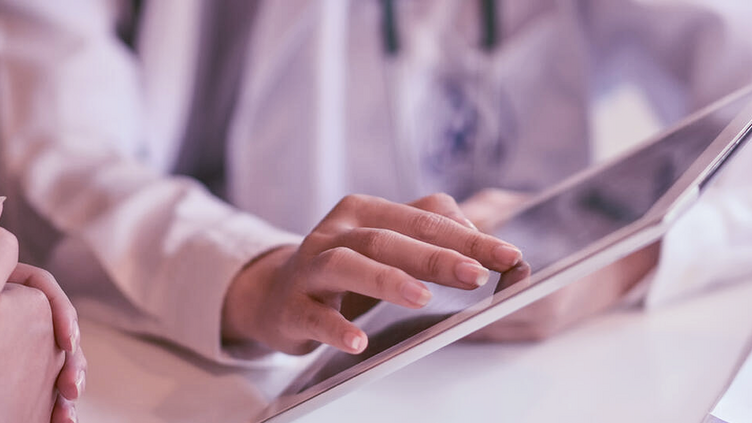 DOCTOR USING TABLET