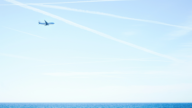 Plane flying over an ocean