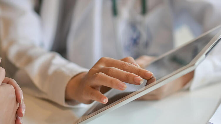 DOCTOR USING TABLET