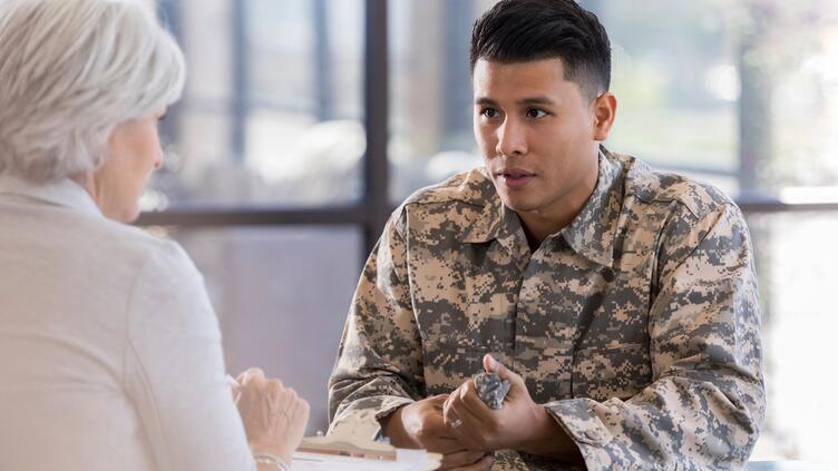 Service member speaking with doctor
