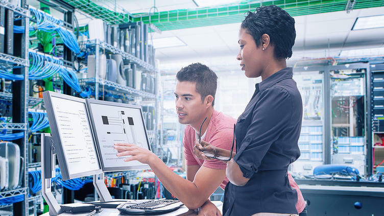 Two engineers evaluating hardware