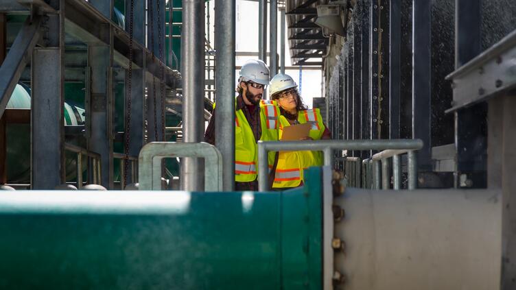 woman man in a manufacturing plant